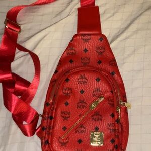 MCM Red Backpack with Signature Monogram and Gold Accents